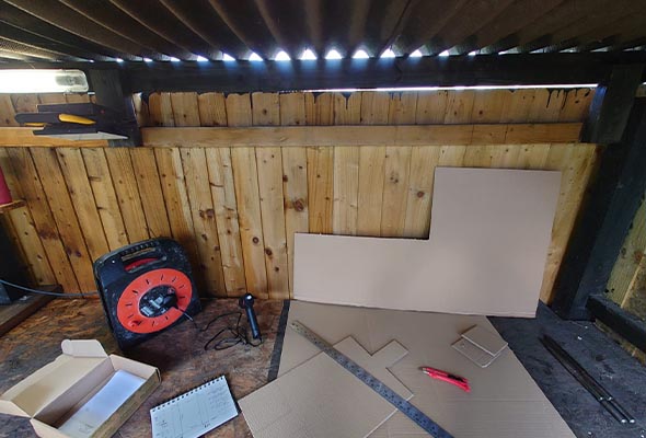 Photo of a makeshift recording studio in a shed